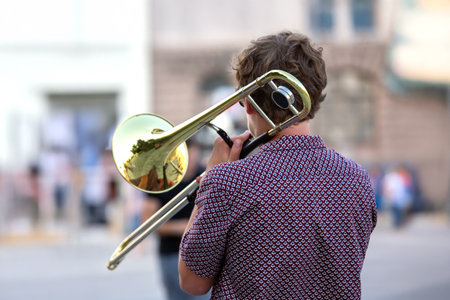 male musician plays the trombone. music and creativity. jazz and bluesの写真素材