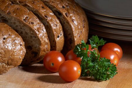 Food composition containing diet bread and small red tomatosの写真素材