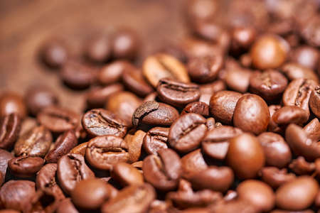 Coffee beans on a wooden background blackの写真素材