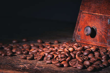 Coffee beans on a wooden background blackの写真素材
