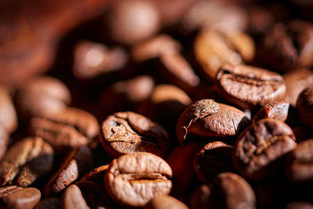 Coffee beans on a wooden background blackの写真素材