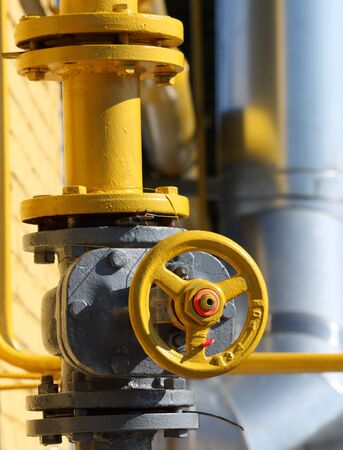 The gas gate, yellow valve and yellow pipes.の写真素材