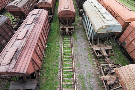 Freight Station with many old wagons of USSR on rails