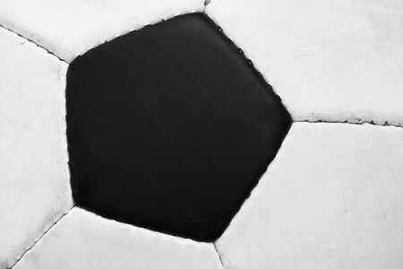 Black pentagon of classic soccer ball - closeup viewの写真素材