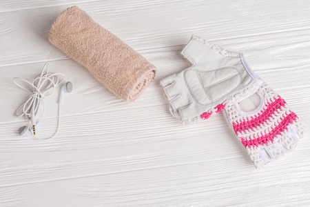 female sports set on a white wooden background with a rope for jumpingの写真素材
