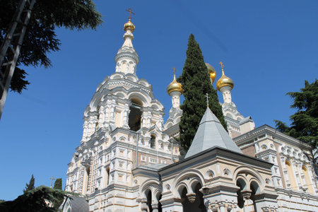 church, golden baths, crosses, blue sky, green cypresses, chapel, blue dome