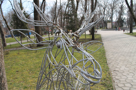 garden sculpture, head, elk, openwork welding, from pieces of reinforcement, painted grayの写真素材