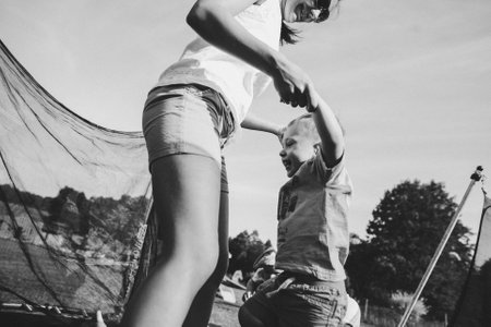 happy family on a trampolineの写真素材