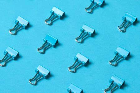 Pattern of blue metalic paper clipsの写真素材