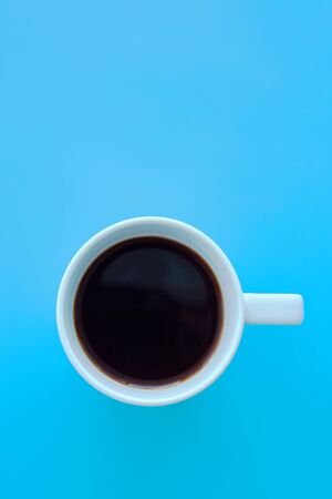 a cup of coffee on blue backgroundの写真素材