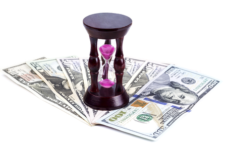 An hourglass is on the dollarの写真素材