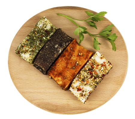 Bacon sprinkled with spices on a boardの写真素材