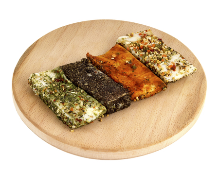 Bacon sprinkled with spices on a boardの写真素材