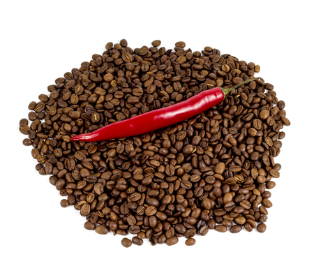 red chili peppers on a black coffee beansの写真素材