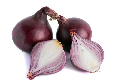 Two whole onion bulbs on a white background and one cut in halfの写真素材