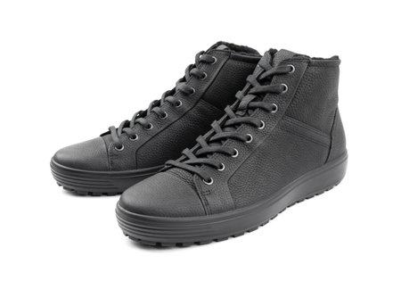 Men's sports leather boots on a white background. Men's sports winter boots with laces.の写真素材