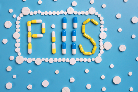 Pharmaceutical medicine pills, tablets on blue backgroundの写真素材