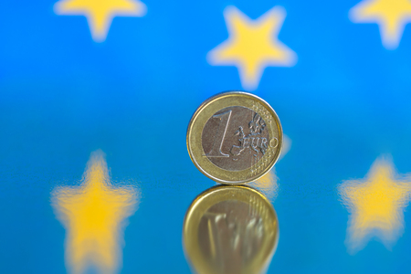 Euro coins on a blue background. Copy space for textの写真素材