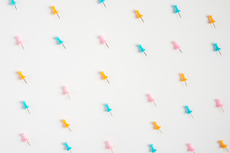 Colorful pushpins on white. Colored pushpins. Office accessories. Office supplies on white. の写真素材