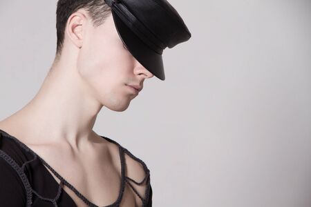 Beautiful strong face male model in fashion clothes on white isolated font backgroundの写真素材