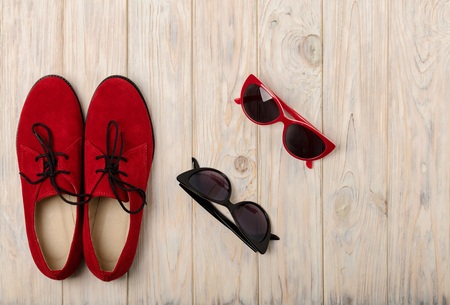 Red women shoes oxfords and sunglasses. Selective focus.の写真素材
