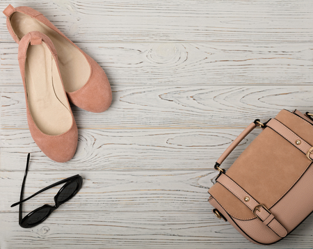 Women's accessories - gently pink, flesh-colored - shoes, bag and sunglasses. Selective focus.の写真素材