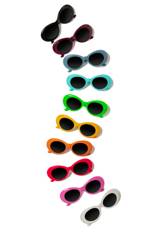 Collection of fashionable multi-colored sunglasses - a trend of summer on an isolated background. Selective focus.の写真素材