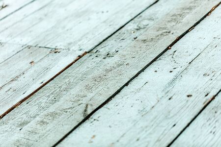 Old worn wooden background of blue and cyan. Blur effect.