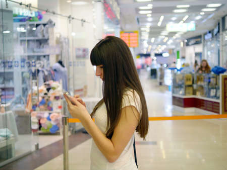 Girl play the popular smartphone gameの写真素材