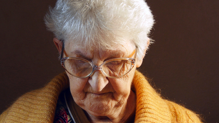 Grandmother reading a book.