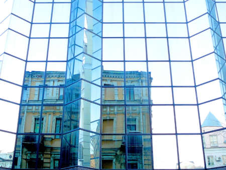 reflection of old mansion in new business-centreの写真素材