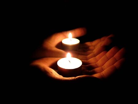 palm with candle in mirrorの写真素材