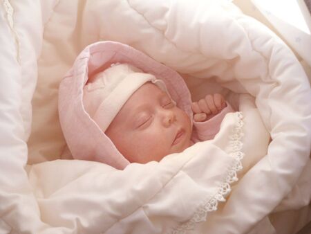 dreaming sweet baby girl wrapped soft blanketの写真素材