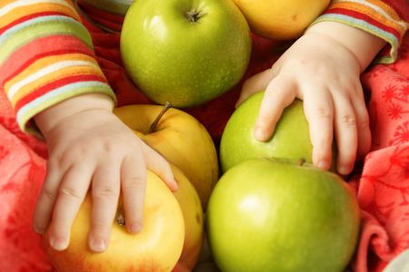 little hands hold a lot of applesの写真素材