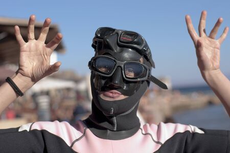 portrait girl-diver in mask and swimsuit, doing の写真素材