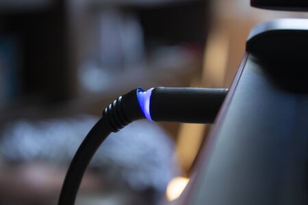 wire with lights attached to laptop. Laptop power and information transferの写真素材