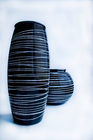 Two vases of different sizes on white backgroundの写真素材