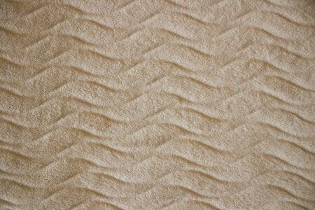 Delicate texture of the blanket,fluffy peach background, pattern
