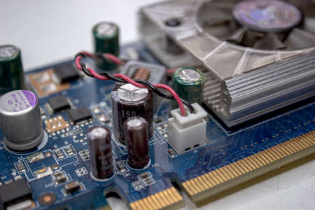 A microchip with components in close-up. Processor with resistors, transistors and chip components