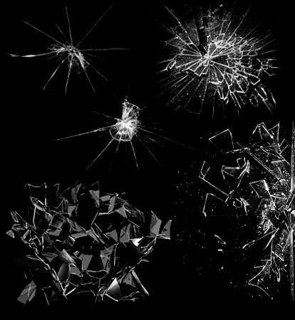 Overlay the effect of glass damage. Split glass on a black background. A crack in the glass.の写真素材