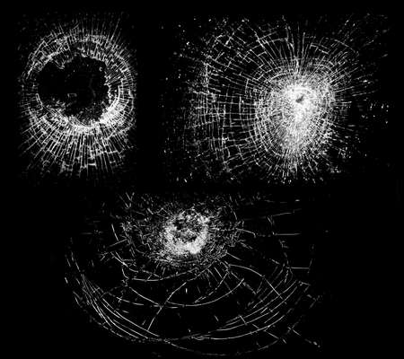 Overlay the effect of glass damage. Split glass on a black background. A crack in the glass.の写真素材