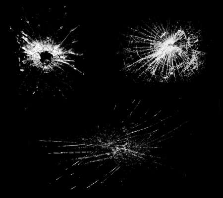 Overlay the effect of glass damage. Split glass on a black background. A crack in the glass.の写真素材