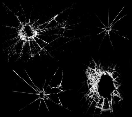 Overlay the effect of glass damage. Split glass on a black background. A crack in the glass.の写真素材