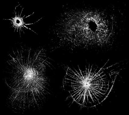 Overlay the effect of glass damage. Split glass on a black background. A crack in the glass.の写真素材
