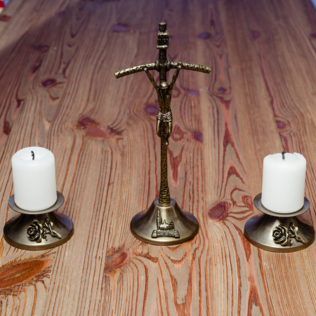 cross, candles and sprinkler