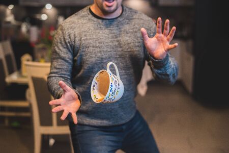 Levitating a cup of teaの写真素材