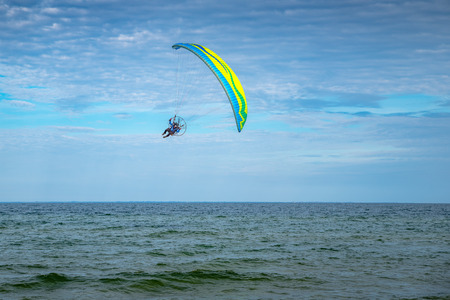 Flying paragliding on the beachの写真素材