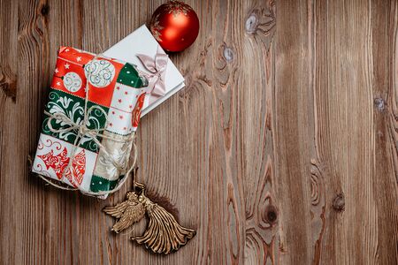 Christmas gifts on a wooden backgroundの写真素材