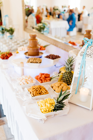 chocolate fountain with fruitsの写真素材