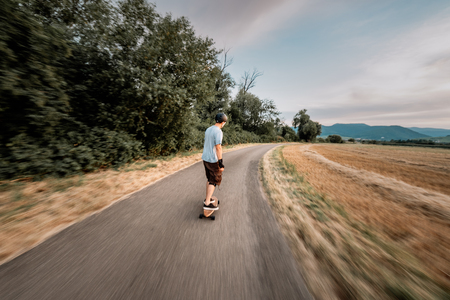 the guy is riding longboardの写真素材